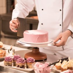 cropped-shot-of-confectioner-making-cake-in-restaurant-kitchen.jpg